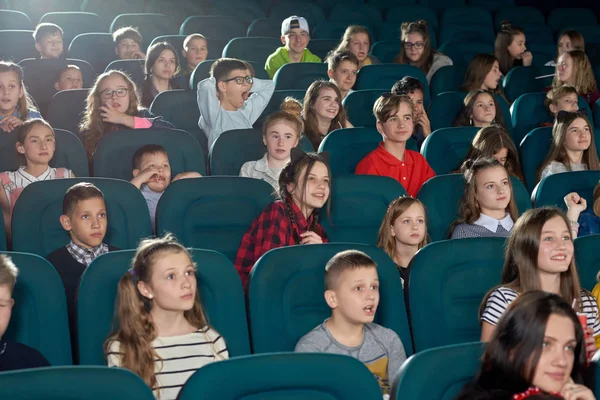 Photo of funny children watching movie in the cinema. — Stock Photo, Image