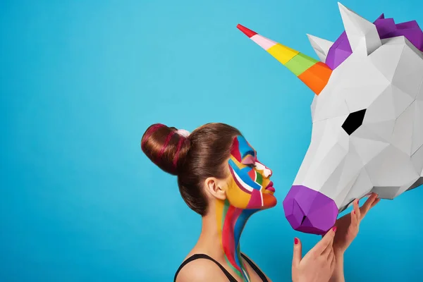 Sideview of pop art portrait of model wearing colorful figures on her face. — Stock Photo, Image