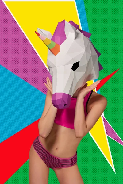Slim model wearing colorful unicorns head, posing on saturated background. — Stock Photo, Image