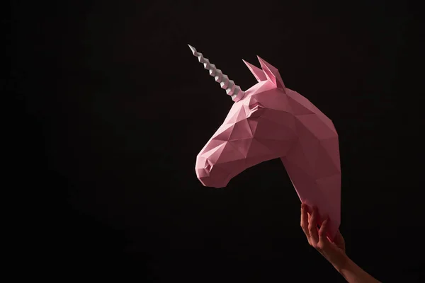 Pink paper unicorns head on black background. — Stock Photo, Image