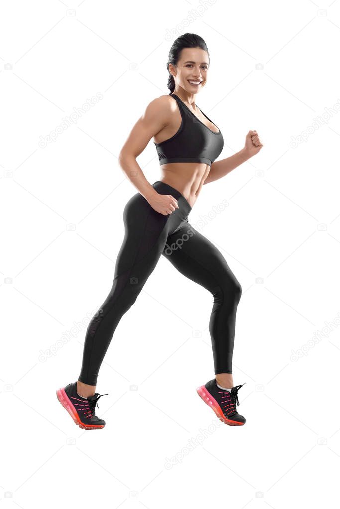 Studio photo of posing athletic female on white background.