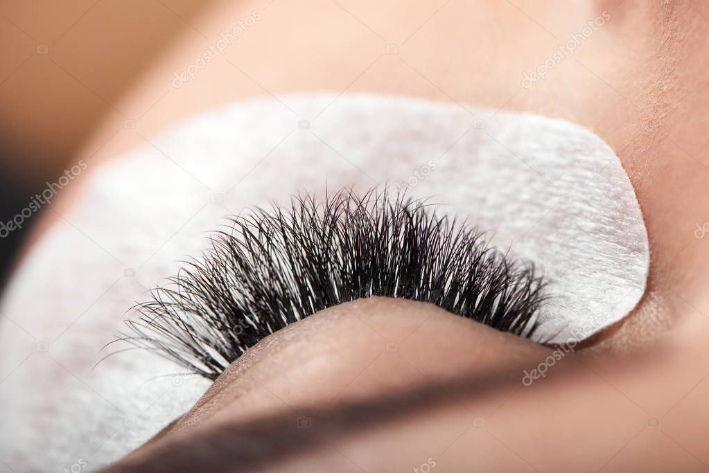 Close up of long enlarged woman s lashes.