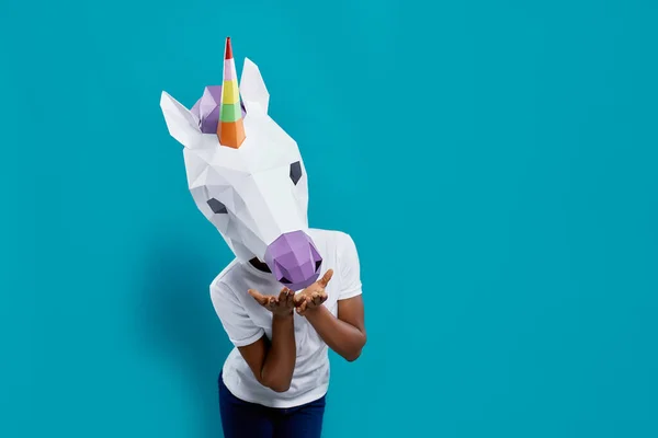 Female posing with colorful 3d papercraft in form of unicorn — Stockfoto