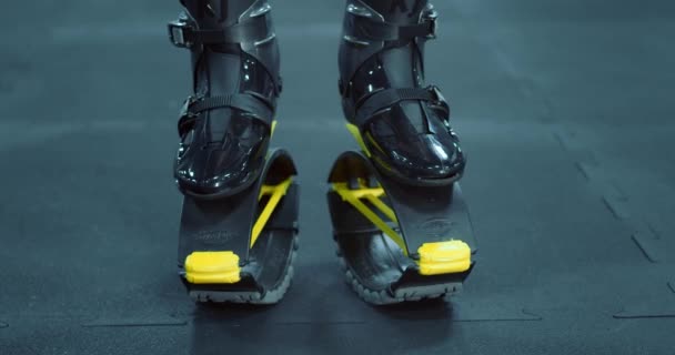 Close up of woman legs while doing kangoo jumps. — Stok video