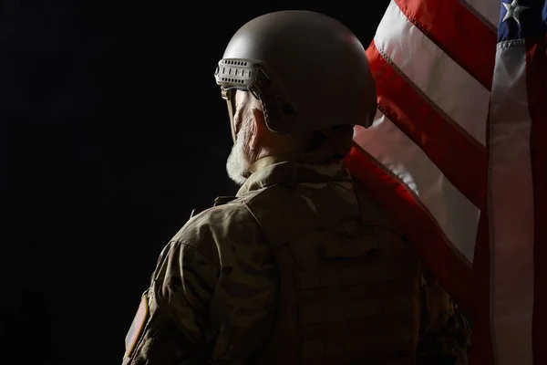 Old american military officer holding flag. — Stock Photo, Image