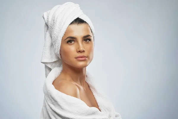 Woman in bathrobe and towel posing. — Stock Photo, Image