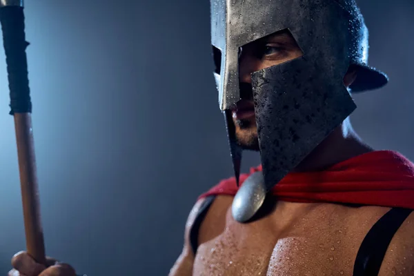 Spartan warrior in iron helmet. — Stock Photo, Image