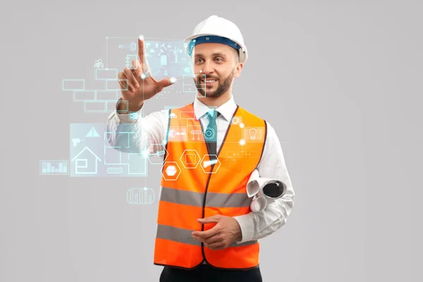 Smiling architect touching virtual 3D icon. — Stock Photo, Image