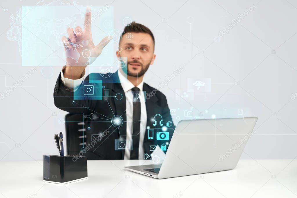 Businessman using virtual 3D projection.
