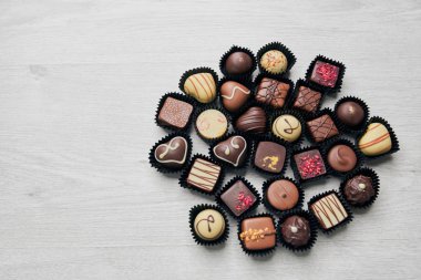 Assorted chocolate sweets in shape of circle.