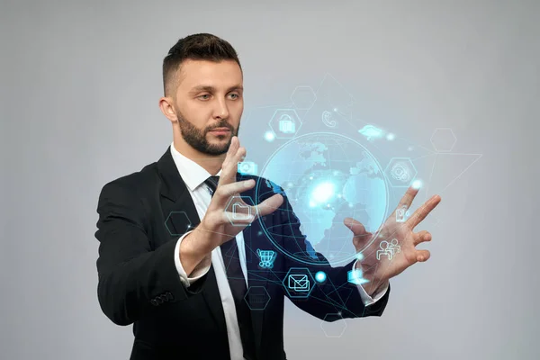 Businessman holding virtual 3D projection in arms. — Stock Photo, Image