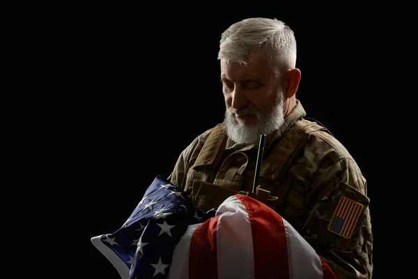 Military veteran holding american flag. — Stock Photo, Image