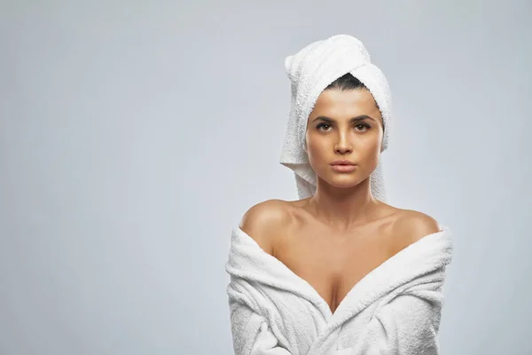 Woman in bathrobe and towel posing. — Stock Photo, Image