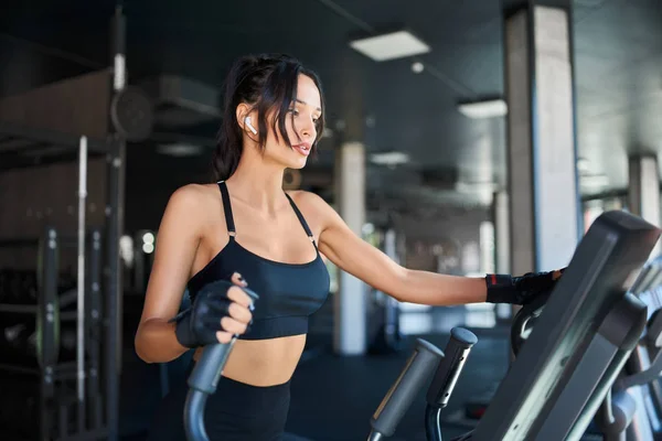 Fitness woman training on treadmill. — Stock Photo, Image