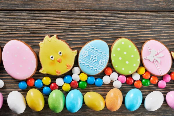 Easter ginger cookies and candies on table. — Stock Photo, Image