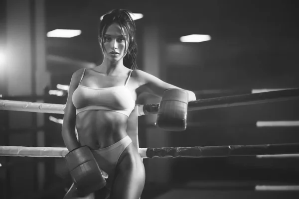 Female boxer posing near ring, monochrome. — Stock Photo, Image