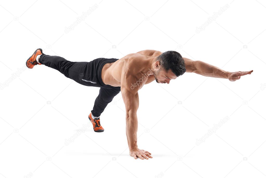 Fit man stretching, isolated on white.