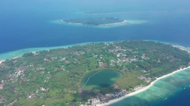 island with lovely tiny buildings surrounded by green forest
