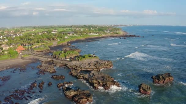 Aerial footage of black volcanic beach, green rice terraces. Bali, Indonesia — Stock Video