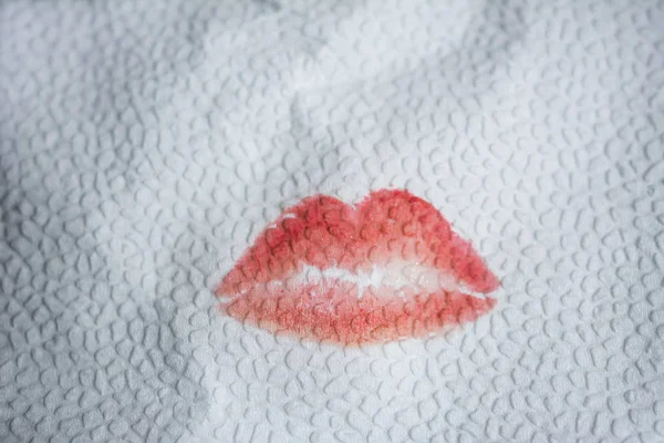 Kiss lipstick from lips on a paper napkin