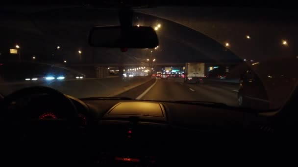 Trip on a car on a night highway lit by flashlights — Stock Video