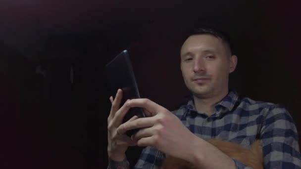 Blogger Man Sitting Dark Room Broadcasts Online Tablet — Stock Video