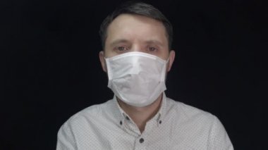 Man in medical mask, protection against coronavirus and various diseases