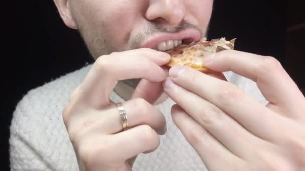 Close Man Eats Pizza Black Background — Stok video