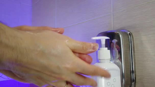 Man Washes His Hands Thoroughly Soap Bathroom Water Flows Tap — Stock Video