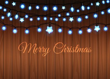Glowing garland set on wood background clipart