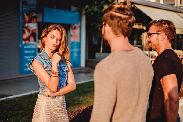 Girl choosing between two man — Stock Photo, Image