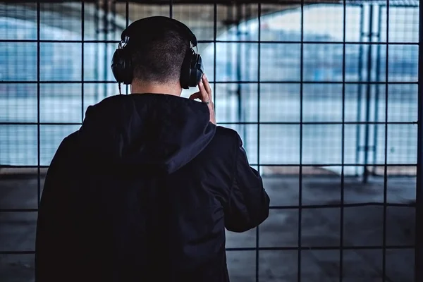 Man with headphones from the back