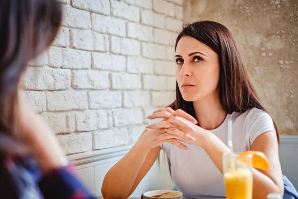 Girl trying to remember something at the cafe — Stock Photo, Image