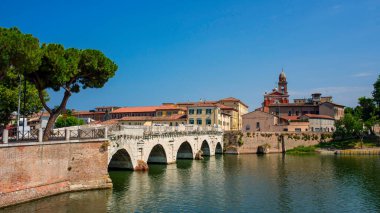 Old bridge over the river in the city of Rimini. Old Italy architecture clipart