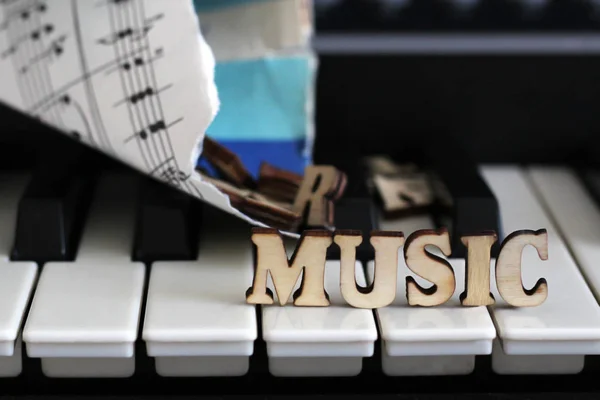 13 March 2018 Russia, Izhevsk. Piano keys closeup with the letters music — Stock Photo, Image