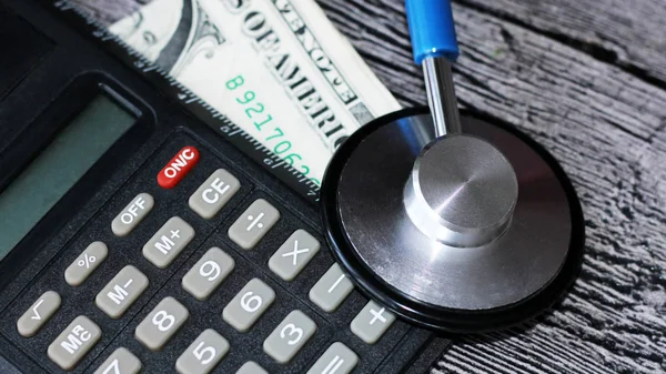 Medical stethoscope on dollar bills — Stock Photo, Image