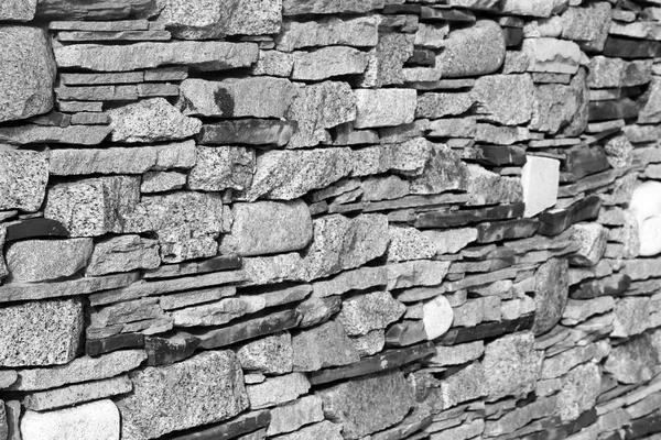 Fragment van een muur van een gechipte steen — Stockfoto