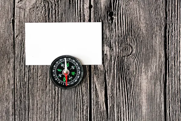 Plastic compass and paper for notes — Stock Photo, Image