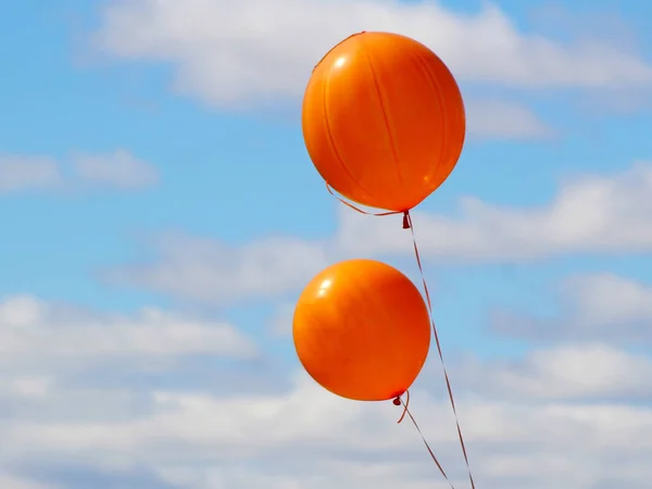 Two orange balloons on sky background — Stock Photo, Image