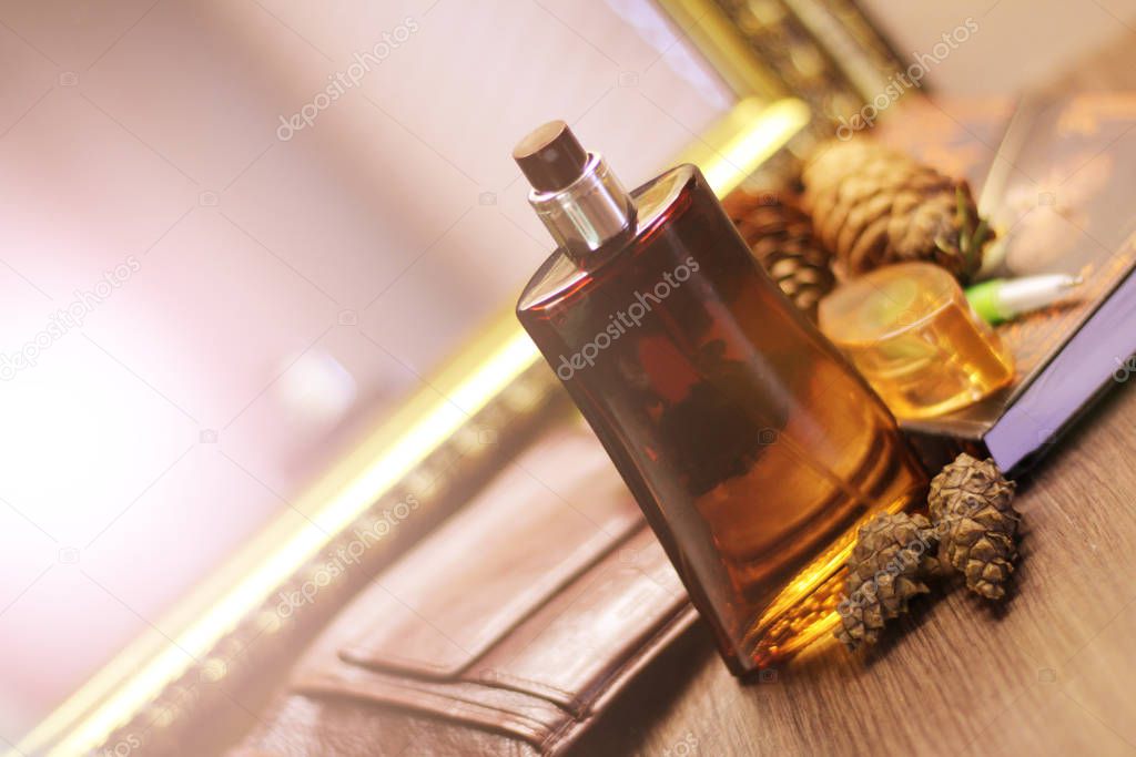 Perfume in brown glass and fir cones, fragrance composition, luxery object