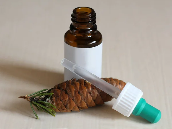 Medicine and pine cones, plant extract. The scent of the forest. Object.