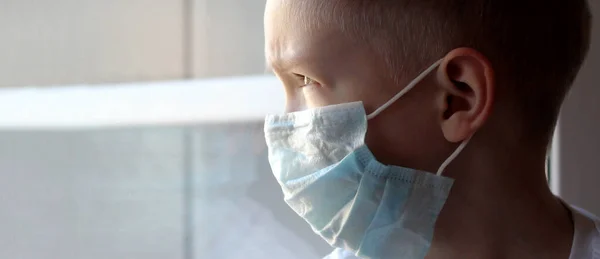 Toddler boy with a medical mask on his face Warning of the dangers of traveling to China and safety measures against coronavirus 2019 nKoV Coronavirus originating in Wuhan, China Close-up portrait