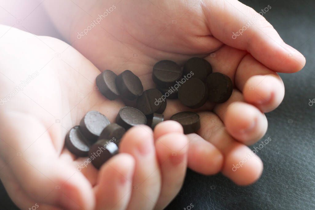 Black tablets in children's hands so close