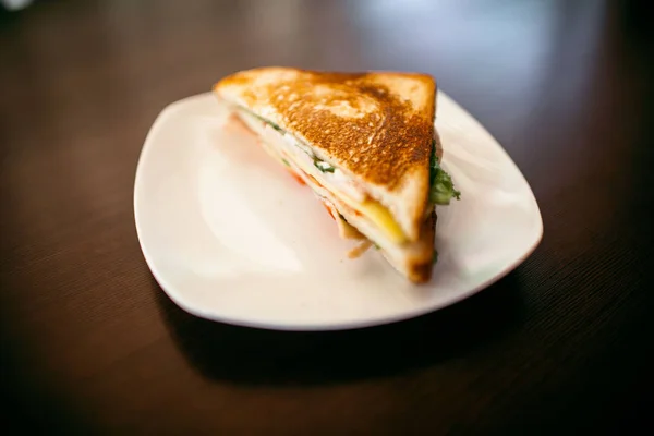 Sandwich on a wood table — Stock Photo, Image