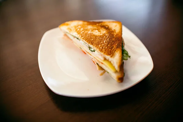 Sandwich on a wood table — Stock Photo, Image