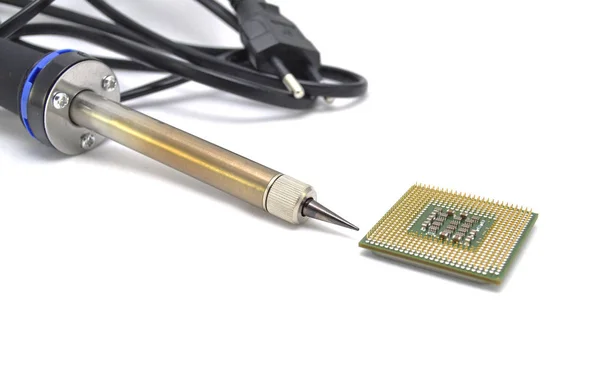 Processor and soldering iron on a white background close up