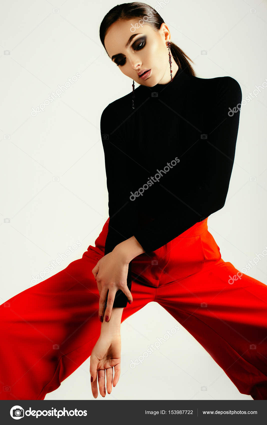 red pant black shirt