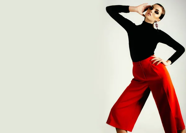 Woman in black shirt and red pants — Stock Photo, Image