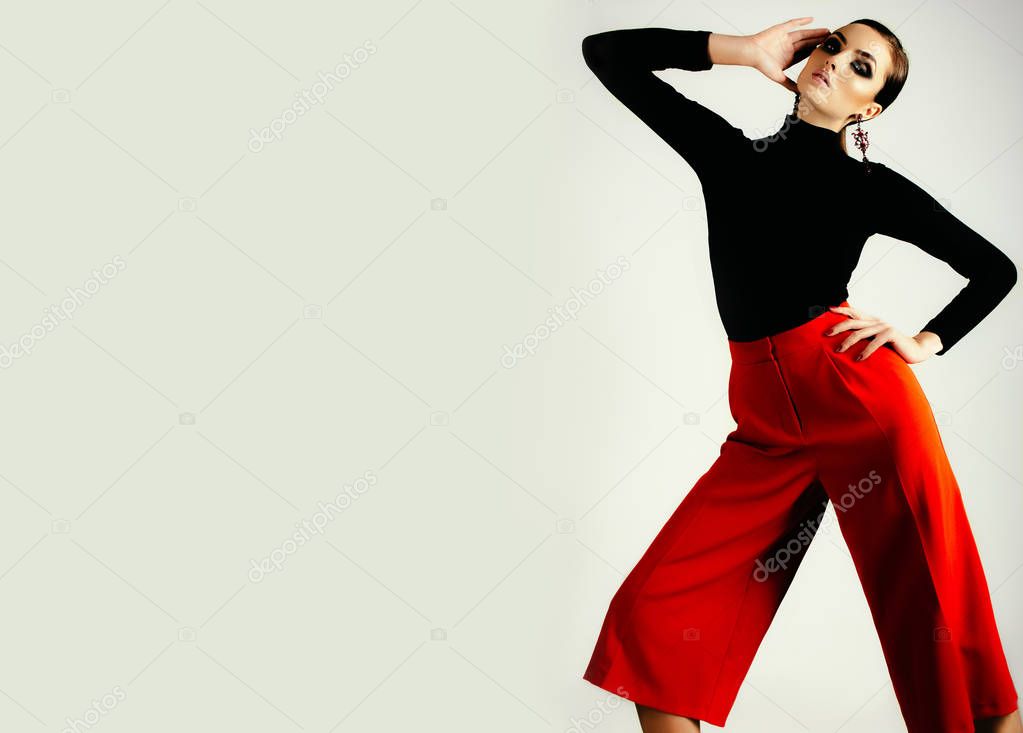 woman in black shirt and red pants