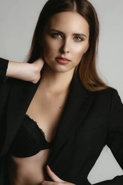 Woman in black lingerie and suit — Stock Photo, Image